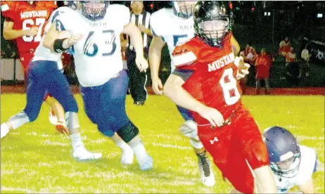  ?? PHOTO BY RICK PECK ?? McDonald County’s Oakley Roessler turns the corner but gets tripped up after a short gain during the Mustangs 26-6 loss to Salem on Aug. 19 at MCHS.