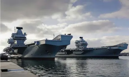  ?? Photograph: LPhot Ben Corbett/MoD/Crown Copyright/PA ?? HMS Queen Elizabeth and HMS Prince of Wales in Portsmouth. ‘The new challenges cannot be met by turning back to nukes and aircraft carriers.’
