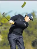  ?? Eric Risberg The Associated Press ?? Phil Mickelson follows through on a shot from the second fairway of the Monterey Peninsula Country Club Shore Course in the first round of the AT&amp;T Pebble Beach Pro-am on Thursday.