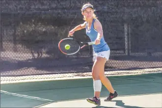  ?? Cory Rubin/The Signal (See additional photos on signalscv.com) ?? Saugus singles player Natalie Ratzlaff returns a volley at the Foothill League Prelims at the Paseo Club in Valencia Wednesday morning.