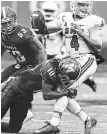  ?? THE COMMERCIAL APPEAL VIA AP ?? Memphis’ Dontrell Nelson sacks SMU quarterbac­k Matt Davis during the first half of Saturday’s game.