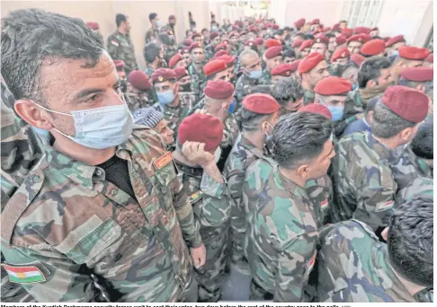  ?? AFP ?? Members of the Kurdish Peshmerga security forces wait to cast their votes, two days before the rest of the country goes to the polls.