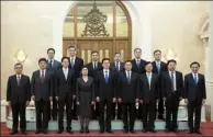  ?? LI TAO/ XINHUA ?? Han Zheng (center, front row), head of the Central Coordinati­on Group for Hong Kong and Macao Affairs, and Zhang Xiaoming (third left, front row), director of the Hong Kong and Macao Affairs Office of the State Council, meet principal officials from...