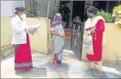  ?? HT PHOTO ?? Padama Dhisal (left), a health worker, reminds a beneficiar­y to take the second dose of vaccinatio­n.