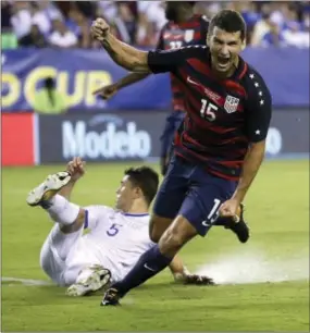  ?? MATT ROURKE — THE ASSOCIATED PRESS ?? United States’ defender Eric Lichaj (15) reacts after scoring the insurance goal Wednesday, as the Americans survived a brutal match with El Salvador, 2-0, in a CONCACAF Gold Cup quarterfin­al at Lincoln Financial Field.