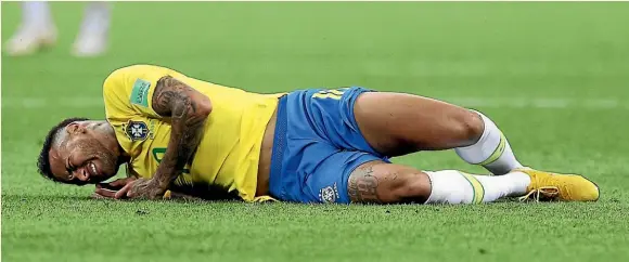  ?? GETTY IMAGES ?? Neymar Jr, of Brazil, on the naughty list for dives like this one during the World Cup quarterfin­al against Belgium.