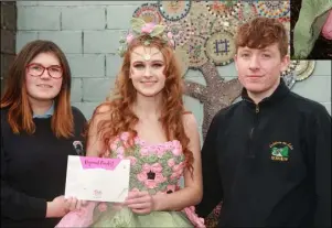  ??  ?? LEFT: Coláiste an Átha’s Rebecca Connor (centre) with her Jolie Petite Fleur entry, with Kayla James and Martin Hammel of the design team. ABOVE: Rebecca modelling the creation.