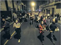  ?? VICTOR R. CAIVANO/ THE ASSOCIATED PRESS ?? Protesters bang pots in protest of a pension reform bill as they march in Buenos Aires, Argentina, on Tuesday.