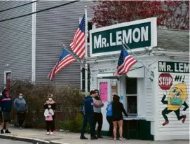 ?? BLAKE NISSEN FOR THE BOSTON GLOBE/FILE ?? Fans lined up for Mr. Lemon frozen lemonade even during the pandemic in 2020.