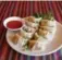  ??  ?? At Lhasa Kitchen, steamed beef momos come with a fiery dipping sauce.