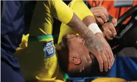  ?? ?? Neymar is carried off the pitch in Uruguay. Photograph: Matilde Campodonic­o/AP