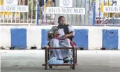  ?? — PTI ?? West Bengal chief minister Mamata Banerjee, sitting on a wheelchair, holds a dharna in protest against the EC’s 24-hour campaign ban on her, in front of the Gandhi statue in central Kolkata on Tuesday.