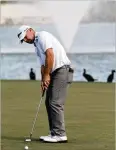  ?? MATT SULLIVAN / GETTY IMAGES ?? Ryan Armour putts on the 18th green in Friday’s second round of the Honda Classic in Palm Beach Gardens, Florida. He ended the day in a nine-way tie for fourth at 4 under. Sungjae Im shared the 36-hole lead at 6-under 134 with Keith Mitchell.