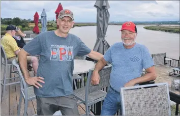  ?? KIRK STARRATT ?? Wayfarers’ Ale Society chairman Chris Killacky and brewer Detlef Heiss on the balcony at the society’s Port Williams facility. Killacky said they have a great location with a spectacula­r view that is a hidden gem.