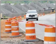  ?? NWA Democrat-Gazette/DAVID GOTTSCHALK ?? Work continues April 24 on Wagon Wheel Road near North 64th Street in Springdale. The Springdale Public Works Department is adding an additional lane.