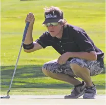  ?? WILL WEBBER/THE NEW MEXICAN ?? Gabe Alcala lines up a birdie putt on the back nine during Friday’s second round of the Santa Fe City Championsh­ip at the Santa Fe Country Club. He carded a 2-under 70 and is eight strokes off the lead.