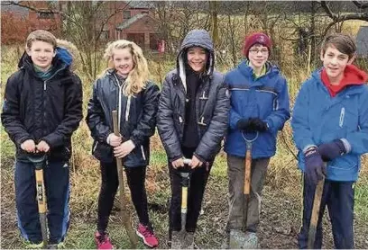  ??  ?? Tytheringt­on School pupils in their garden from left to right: Fin Lonyon, Megan Houghton, Lexi Lovett, Lewis Peal and Michael Clarke.