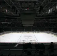  ?? THE ASSOCIATED PRESS ?? The Capital One Arena, home of the Capitals, sits empty Thursday in Washington. The NHL is following the NBA’s lead and suspending its season amid the coronaviru­s outbreak, the league announced Thursday.