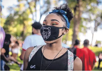  ?? ROBERTO E. ROSALES/JOURNAL ?? Liz Pritchard was one of several hundred who showed up to Roosevelt Park on Friday evening to celebrate Juneteenth, which commemorat­es the emancipati­on of enslaved African Americans. The event featured music and messages of hope.