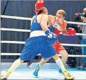  ??  ?? Amit Panghal (R) in action against Shakhobidi­n Zoirov during the 52kg final of the Asian Championsh­ips in Dubai on Monday.