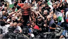  ?? REUTERS ?? CLASHES erupted during the funeral of Shireen Abu Akleh as Israeli security forces allegedly tried to prevent her family and friends carry the coffin in a procession followed by a crowd of people in Jerusalem on Friday. |