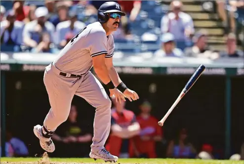  ?? David Dermer / Associated Press ?? The Yankees’ Matt Carpenter watches the ball after hitting an RBI single in the seventh inning in the first game of a doublehead­er against the Guardians on Saturday.