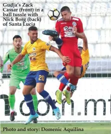  ??  ?? Gudja’s Zack Cassar (front) in a ball tussle with Nick Borg (back) of Santa Lucia Photo and story: Domenic Aquilina