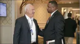  ?? PHELAN M. EBENHACK — AP IMAGES FOR NFL ?? Eagles owner Jeffrey Lurie, left, chats with former Eagle Troy Vincent, NFL executive vice president of football operations, during the NFL owners meetings, Tuesday in Orlando, Fla.