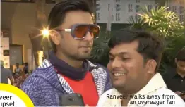  ??  ?? Ranveer walks away from an overeager fan