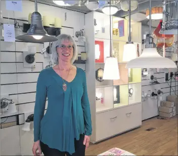  ?? ASHLEY THOMPSON ?? Chris Macquarrie, owner of Atlantic Lighting Studio, has mixed emotions about the impending closure of her business on Main Street in Wolfville. She’ll be sad to bid farewell to the business she’s run for 16 years, but happy to have more time for her...