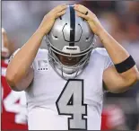  ?? JOSE CARLOS FAJARDO/TRIBUNE NEWS SERVICE ?? Raiders quarterbac­k Derek Carr (4) reacts after being sacked by the 49ers' DeForest Buckner in Santa Clara on Nov. 1.