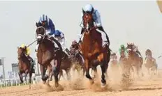  ?? Virendra Saklani/ Gulf News ?? ■ Heavy Metal, ridden by jockey Ryan Moore and trained by Sandeep Jadhav, wins Godolphin Mile race.