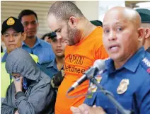  ??  ?? Philippine National Police Chief Gen. Ronald dela Rosa, right, answers questions from the media as he presents arrested foreigner Fehmi Lassoued, also known as John Rasheed Lassoned, allegedly a native of Egypt, along with a Filipino companion Anabel Moncera Salipada, left, Monday. (AP)
