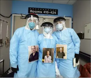  ?? Carolyn Cole Los Angeles Times ?? DR. JOSEPH VARON, left, COVID unit chief at United Memorial Medical Center in Houston, with Times photograph­er Carolyn Cole, center, and staff writer Molly Hennessy-Fiske.