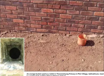  ??  ?? An orange bucket used as a toilet in Thorometsa­ng Primary in Phiri Village, Sekhukhune. Inset is a gaping hole at Tshwahlaga­e Primary School.