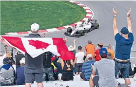  ??  ?? Home favourite: Canadian supporters cheer on Lance Stroll of Williams