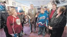  ?? JASON BAIN EXAMINER ?? Peterborou­gh-Kawartha MPP Dave Smith (middle) speaks to members of the Electric City Maroon and White and Kawartha Komets after announcing that March 27 has been proclaimed as Special Hockey Day in the Alumni Room at the Memorial Centre on Monday.