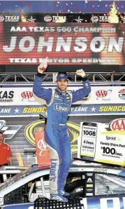  ?? Sarah Crabill / Getty Images for Texas Motor Speedway ?? Atop his No. 48 Chevrolet, Jimmie Johnson rejoices in victory lane after winning Sunday’s Sprint Cup Series AAA Texas 500 at Texas Motor Speedway.