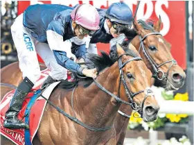  ??  ?? Close thing: Rekindling gets up to beat Johannes Vermeer in the Melbourne Cup