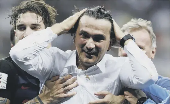  ??  ?? 2 Croatia manager Zlatko Dalic savours the moment after his side came from behind to beat England and clinch a place at the World Cup final where they will face France.