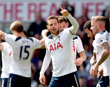  ?? — AFP ?? Vincent Janssen (centre) celebrates with team mates after scoring Tottenham Hotspur’s fourth goal in their English Premier League match against Bournemout­h at White Hart Lane in London on Saturday. Tottenham won 4-0.