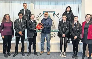  ?? ?? Grateful Duncanrig Secondary have the defibrilla­tor thanks to funding support from Highlander Internatio­nal Recycling