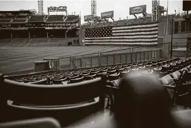  ?? Billie Weiss / Getty Images ?? Fenway Park is decked out for a patriotic return of baseball around July 4, but time is running out to get an agreement in place and complete a second stint of spring training in order to start the season by the holiday.