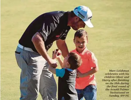  ?? AFP PIC ?? Marc Leishman celebrates with his children Oliver and Harry after finishing on the 18th during the final round of the Arnold Palmer Invitation­al on Sunday.