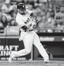  ?? Bob Levey / Getty Images ?? The Astros’ Robinson Chirinos singles in the first inning against the Tigers at Minute Maid Park on Monday. It was part of a four-run first inning for Houston.