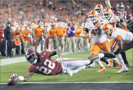  ?? DAVID J. PHILLIP — THE ASSOCIATED PRESS FILE ?? In this Jan. 7, 2019, file photo, Alabama’s Najee Harris reaches for the end zone during the first half the NCAA college football playoff championsh­ip game against Clemson, in Santa Clara After the Power Five conference commission­ers met Sunday to discuss mounting concern about whether a college football season can be played in a pandemic, players took to social media to urge leaders to let them play.