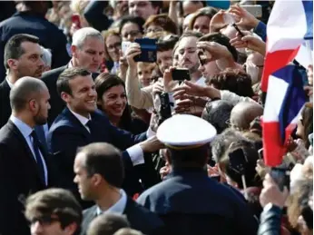  ?? PHILIPPE LOPEZ/AFP/GETTY IMAGES ?? French President Emmanuel Macron said "the time has come for France to rise up to the occasion.”