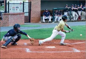  ?? TIM GODBEE / For the Calhoun Times ?? Calhoun’s Alex Hinojosa (right) lays down a bunt during Friday’s game against Haralson County.