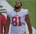  ?? BILL KOSTROUN — THE ASSOCIATED PRESS ?? 49ers tight end Jordan Reed grimaces as he is escorted off the field Sunday with another injury in a career of many.