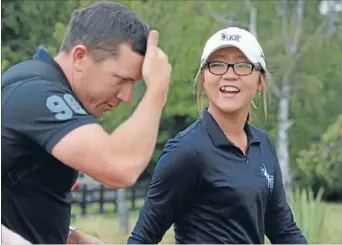  ?? Photo: DEAN
KOZANIC/ FAIRFAX NZ ?? Taxing schedule: Lydia Ko and coach Guy Wilson share a joke during practice for the Newzealand Women’s Golf Open at Pegasus, near Christchur­ch. Ko has withdrawn from the Riversdale Cup in Melbourne after a dizzy spell.